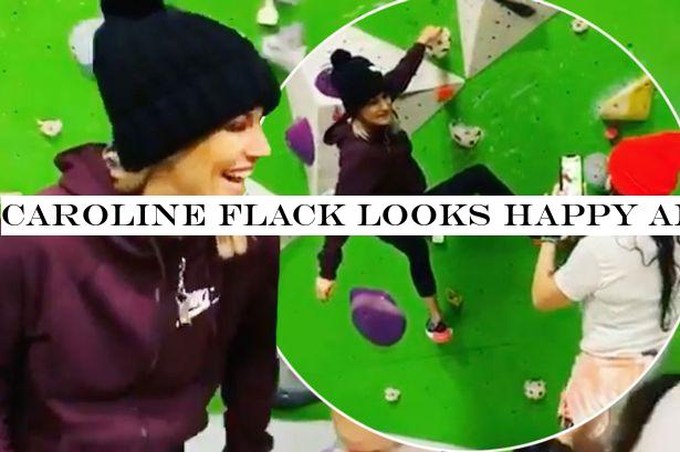 Caroline Flack looks happy and relaxed as she goes rock climbing ahead of trial
