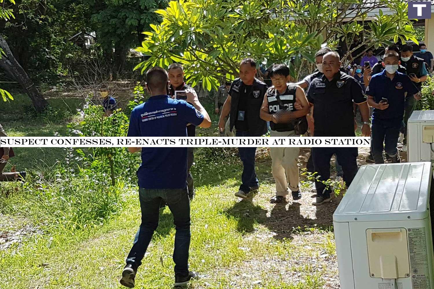 Wim Sonsuk, 59, third from left in a police vest, is escorted by police during the crime re-enactment on Thursday. He is charged with murdering three people, and wounding another, at the Phitsanulok station of Radio Thailand, where he was employed as an electrician, on Wednesday. (Photo: Chinnawat Singha) Suspect confesses, re-enacts triple-murder at radio station