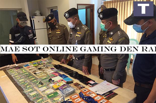 Immigration police show the evidence seized from a raid at an online gambling den in Mae Sot district of Tak province on Saturday. (Photo by Wassayos Ngamkham) Mae Sot online gambling den raided