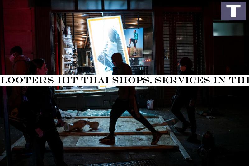 Protesters pass by a store looted after a march against the death in Minneapolis police custody of George Floyd, in the Manhattan borough of New York City on Tuesday. (Reuters photo) Looters hit Thai shops, businesses amid riots