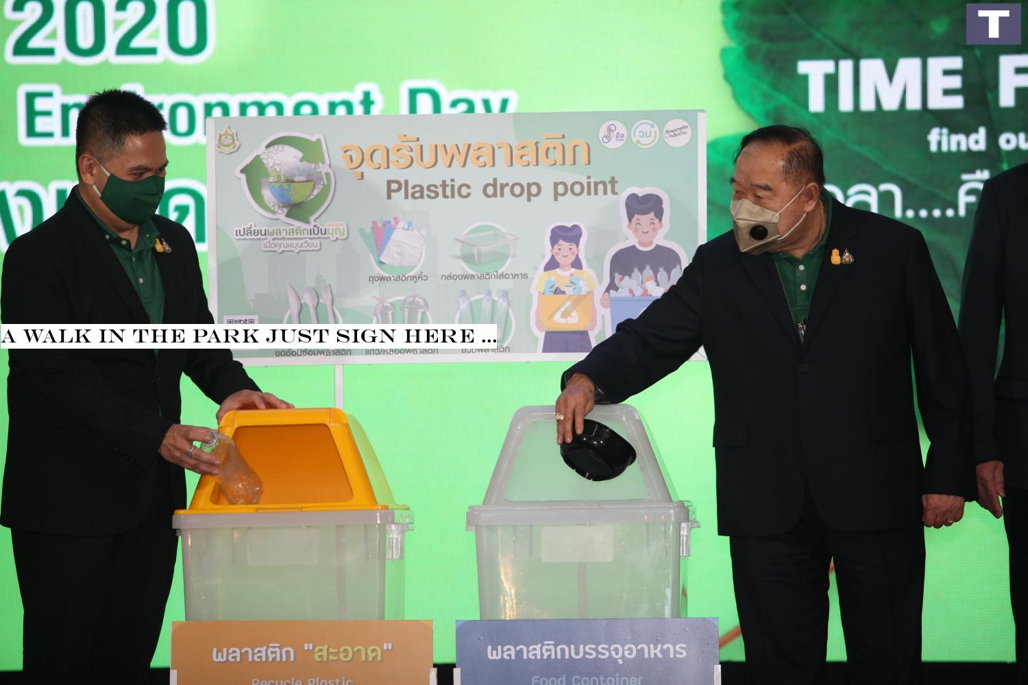 Deputy Prime Minister Prawit Wongsuwon (right) drops a plastic bowl into a recycling bin while presiding over an activity to mark World Environment Day at the Department of Environment Quality Promotion.â-#128;-#137;(Photo by Apichart Jinakul) A walk in the park? Just sign here