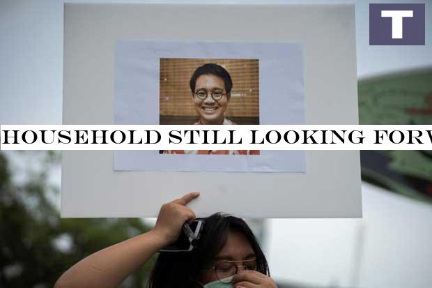 An activist holds a picture of Wanchalearm Satsaksit during a protest for his disappearance in Bangkok on Friday. (Reuters photo) Family still looking forward to missing activist's release