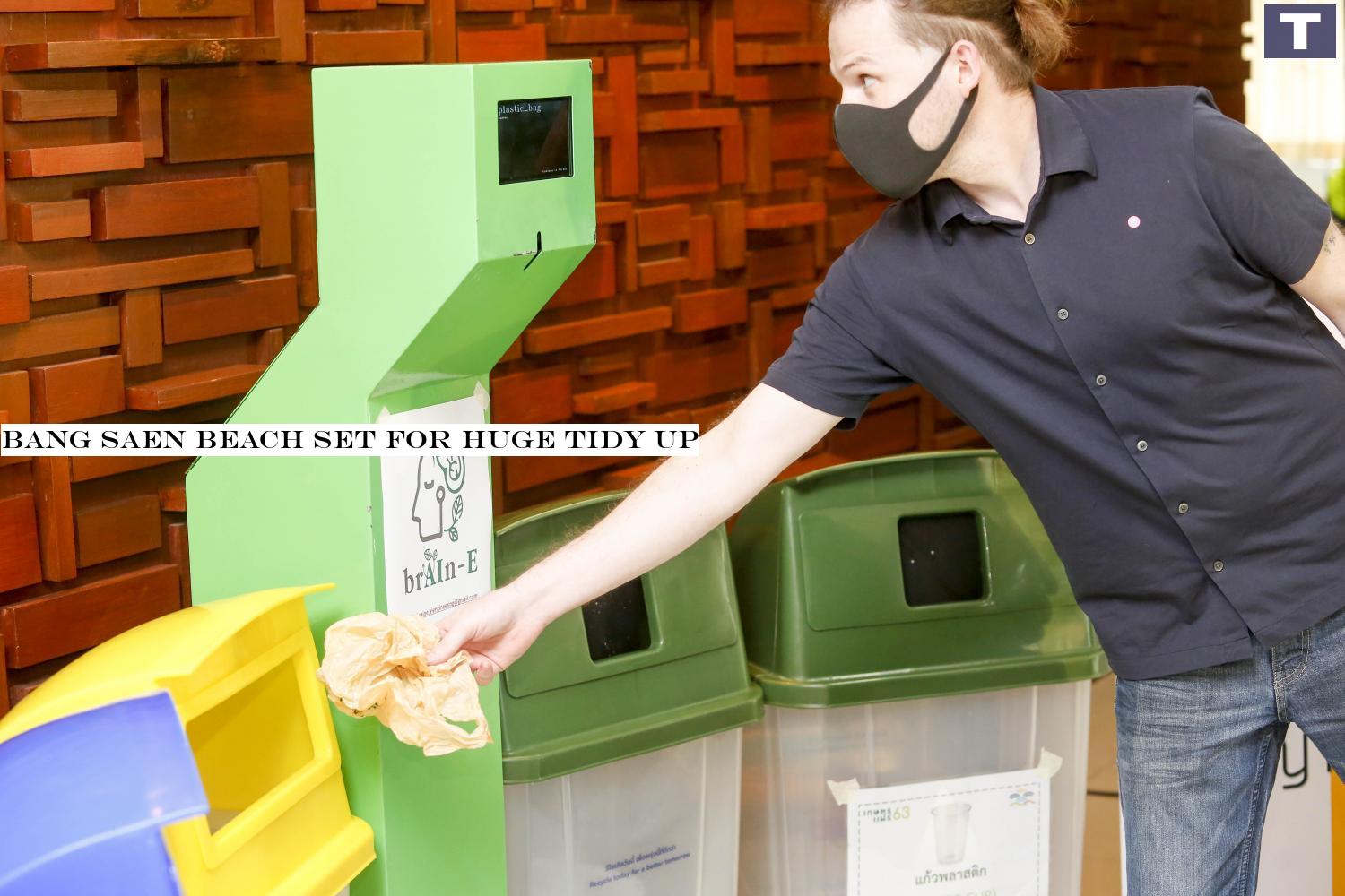 A man drops trash in a bin on Bang Saen beach in Chon Buri. The municipality and Kasetsart University are teaming up for a project to make Bang Saen a 'zero waste beach' which aims to change the way people dispose of waste and recycling the rubbish.â-#128;-#137; Pattarapong Chatpattarasill Bang Saen beach set for big clean up