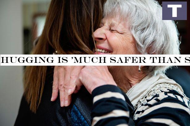 Hugging is 'safer than shaking hands' when lockdown eases, expert claims