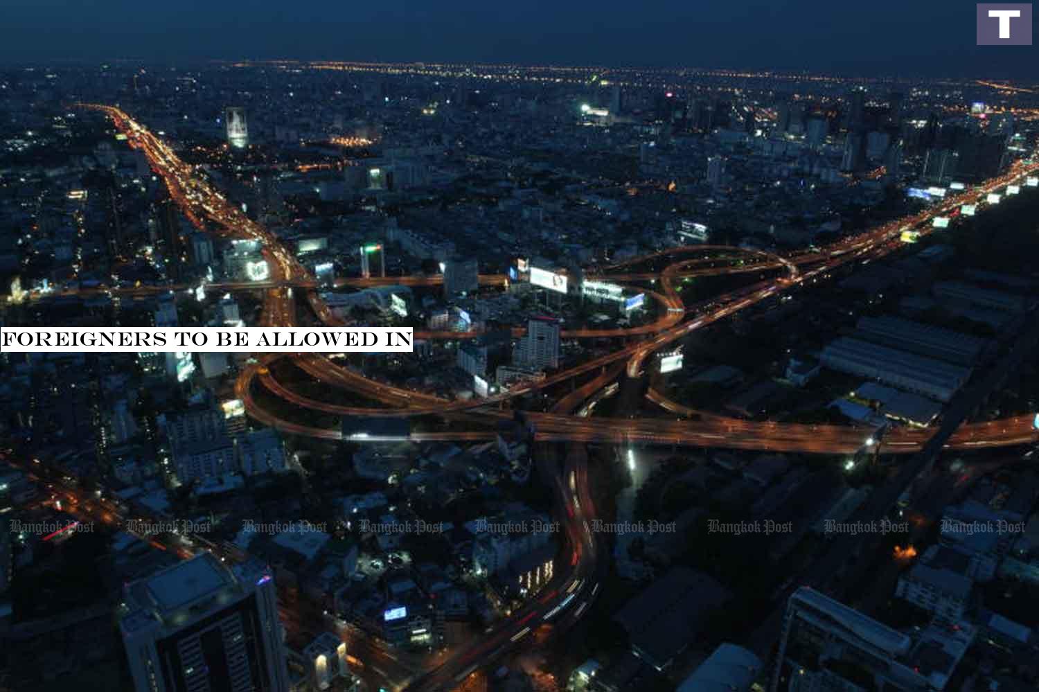 An expressway interchange, photographed from Baiyoke Tower II Sunday night, shows light traffic. Busy traffic is set to return after the night-time curfew was lifted from 11pm Sunday. The lifting of the curfew was published in the 'Royal Gazette'. Arnun Chonmahatrakool Foreigners to be allowed in
