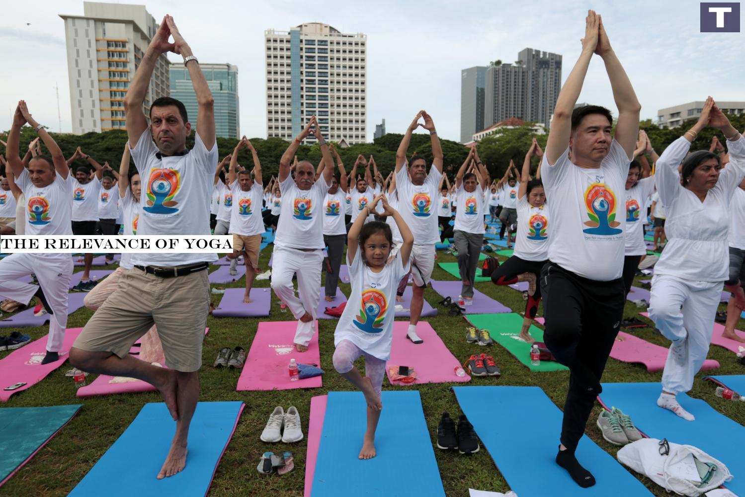 People participate in a mass yoga exercise to mark the 5th International Day of Yoga at Bangkok's Chulalongkorn University last year. The event is held annually worldwide.â-#128;-#137;(Photo by Chanat Katanyu) The relevance of yoga