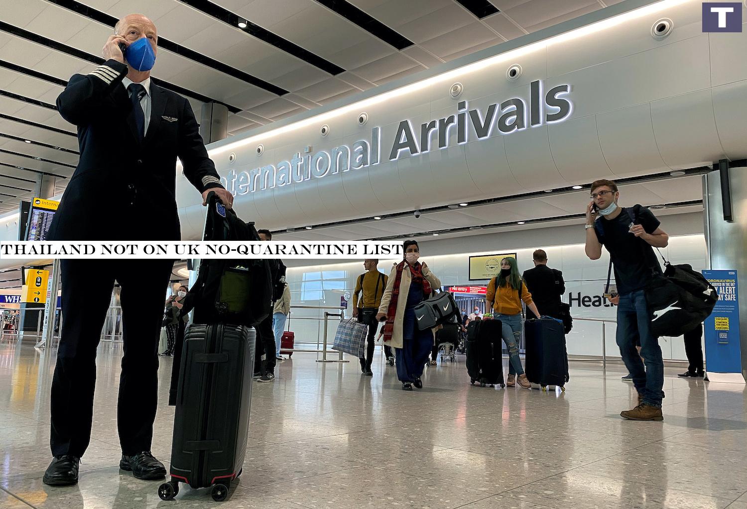 An airline pilot uses his phone in the arrivals hall at Heathrow Airport in London. (Reuters Photo) Thailand not on UK no-quarantine list
