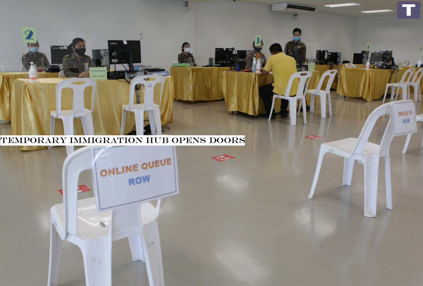 Social-distancing measures are put in place at a temporary centre for immigration services in Nonthaburi's Pak Kret district that is now open to foreign visitors seeking short-stay extensions. (Photo by Apichit Jinakul) Temporary immigration hub opens doors