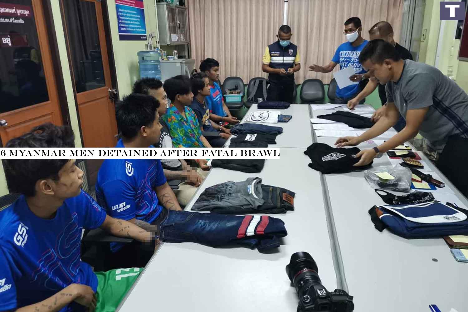 Six Myanmar men, seated left, were brought to Samrong Nua police station in Samut Prakan for questioning after a brawl at the Imperial World Samrong department store in which a Myanmar man was killed on Sunday. (Photo: Sutthiwit Chayutworakan) 6 Myanmar men detained after fatal brawl