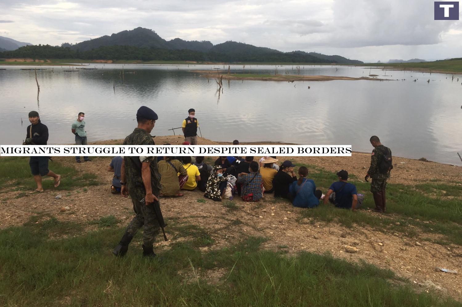the great fisherman con: A file photo taken last week in which territorial defence volunteers posing as fishermen nabbed a group of 18 Myanmar nationals and a Thai helper as they illegally entered the kingdom in Sangkhla Buri of Kanchanaburi. Migrants struggle to return despite sealed borders