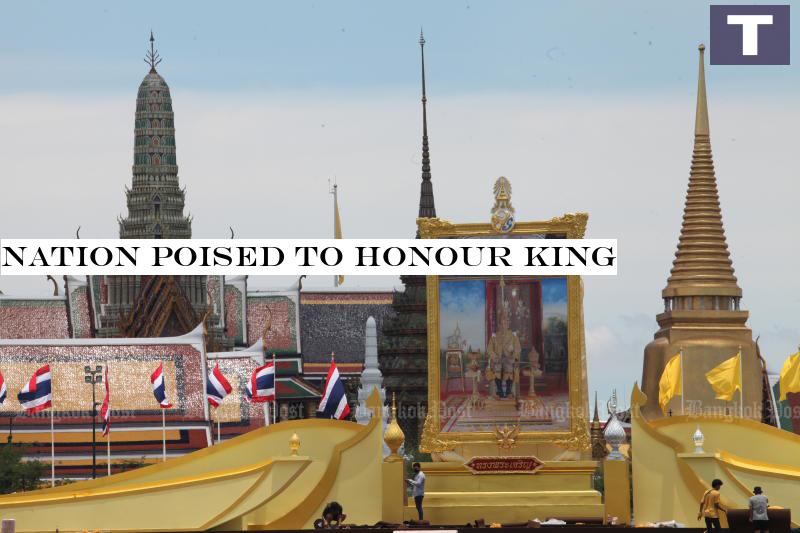 A portrait of His Majesty the King is seen at Sanam Luang, where a full day of religious and state ceremonies has been scheduled to mark the auspicious occasion. Nation poised to honour King