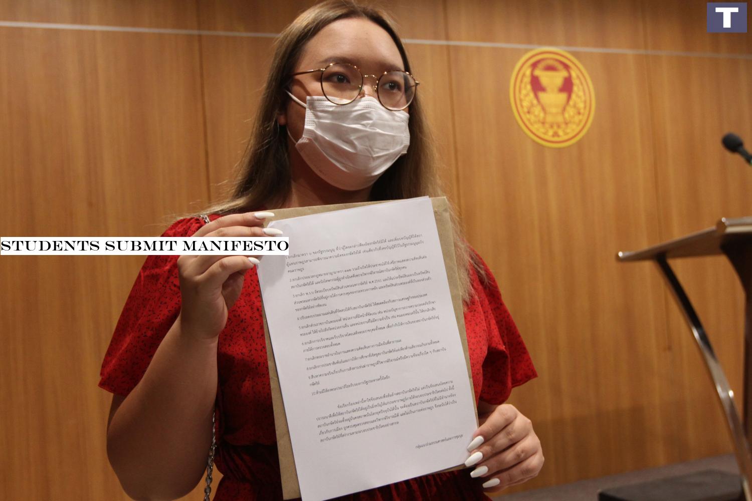 Activist Panasaya Sitthijirawattanakul with the document she submitted. (Photo by â-#128;-#137; Wichan Charoenkiatpakul) Students submit manifesto