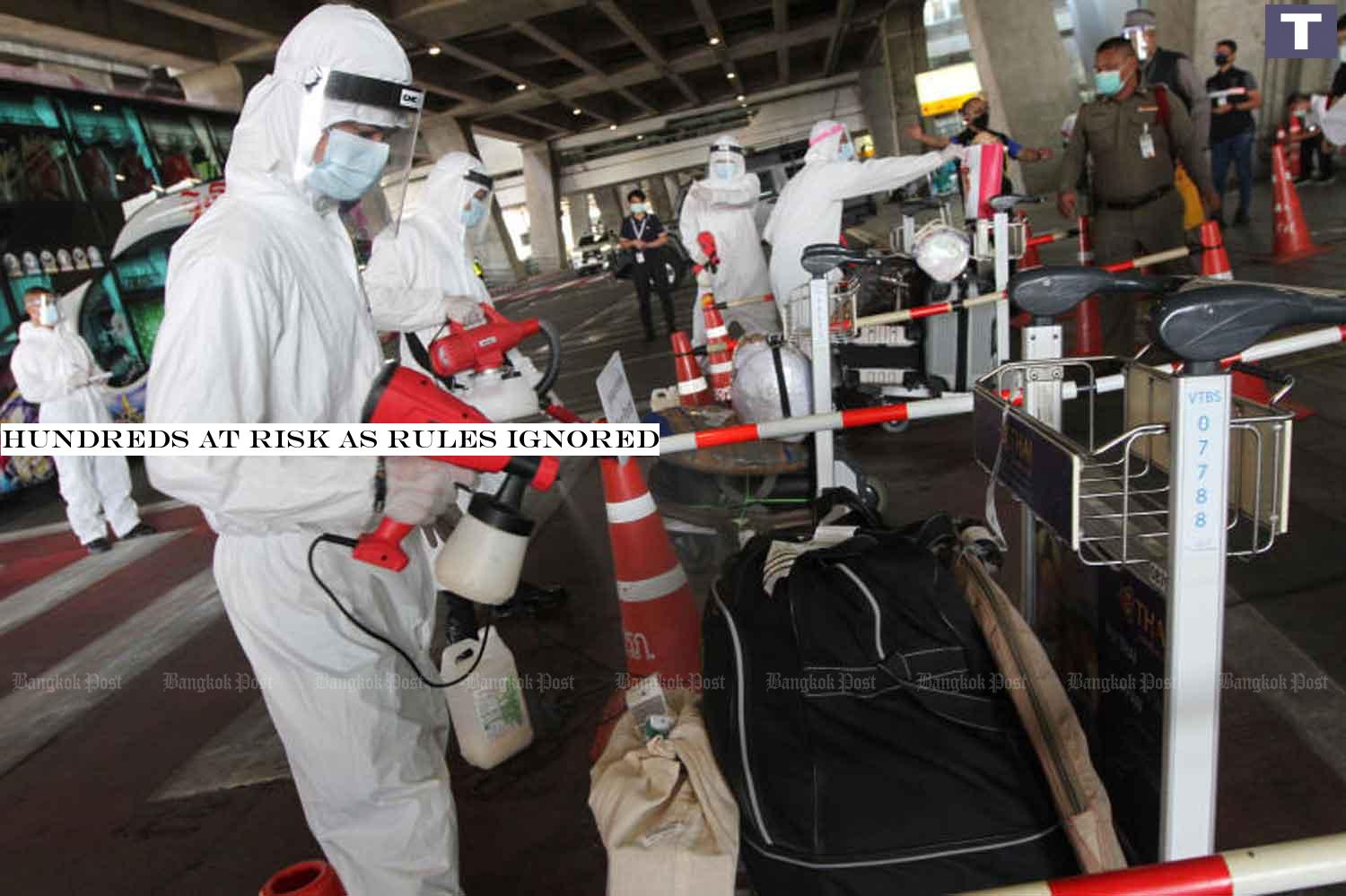 Officials in protective gear spray disinfectant on the luggage of passengers who arrived on Sunday at Suvarnabhumi airport from India. Flight AI334 carried 40 Thai returnees and 68 foreign nationals. Two monks had a fever and were isolated for testing. The rest were sent for 14-day quarantine. WICHAN CHAROENKIATPAKUL Hundreds at risk as rules ignored