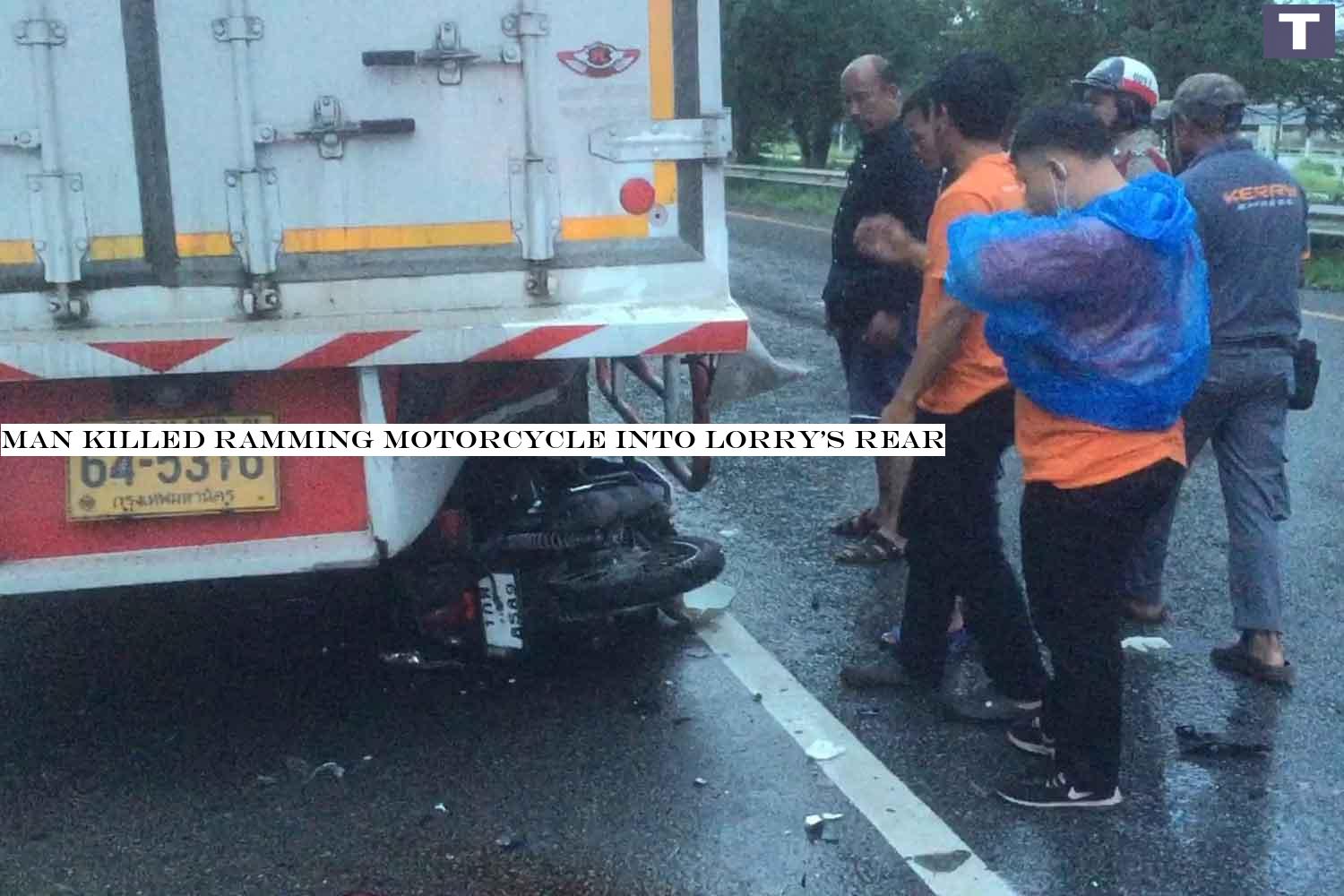 Rescuers take a look at a motorcycle, which was left lying underneath a lorry on Asian Highway in Songkhla's Bang Klam district. The driver was killed after ramming the motorcycle into the rear of the lorry on Sunday. ASSAWIN PAKKAWAN Man killed ramming motorcycle into lorry's rear