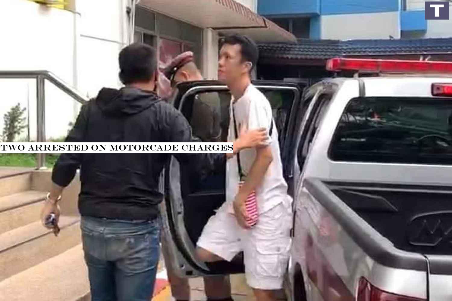Police take Ekachai Hongkangwan into Lat Phrao police station, Bangkok, on Friday morning. (Photo supplied) Two arrested on motorcade charges
