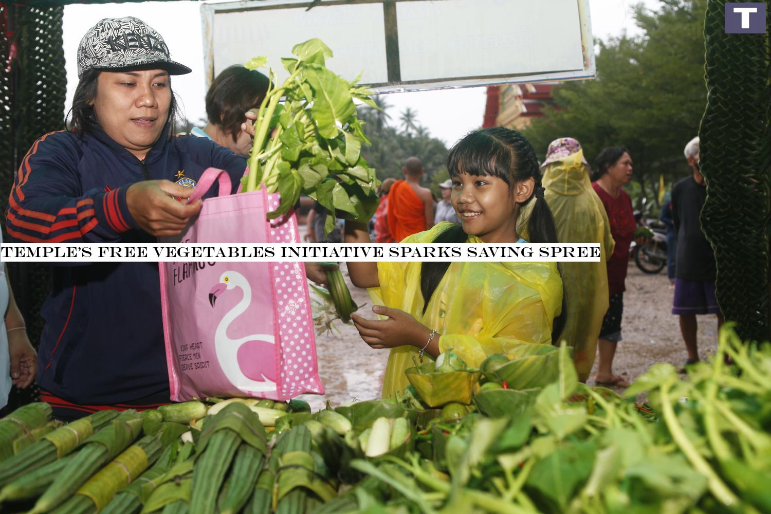 A friend where needed: A family picks vegetables given away for free at Wat Bang Khonthi Nai in Samut Songkhram province. The free produce project has forged a sense of sharing and enabled some families to put away money for a rainy day. Temple's free vegetables initiative sparks saving spree