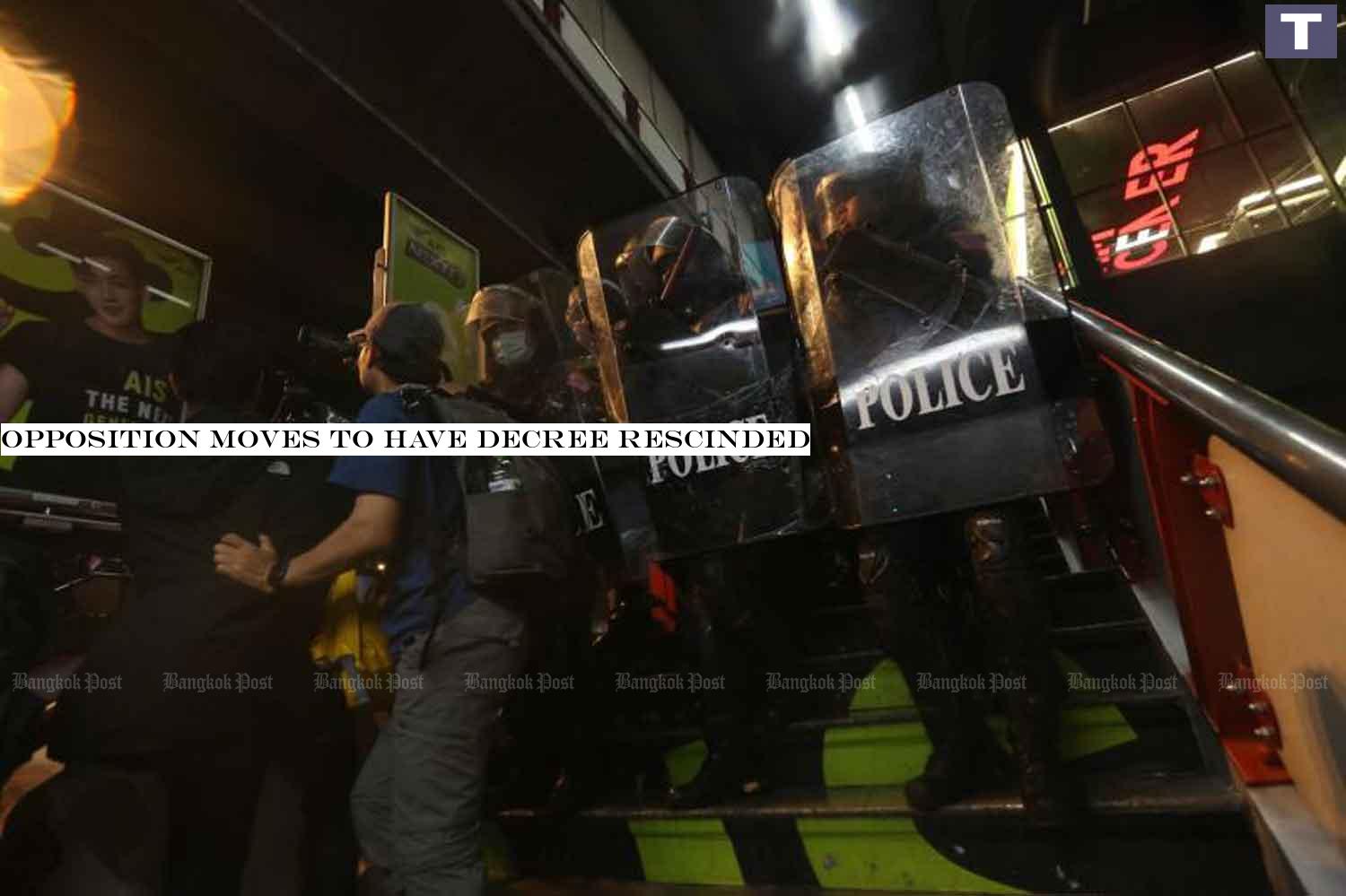 Riot police near Pathumwan intersection in Bangkok last Friday. (Photo by Pattarapong Chatpattarasil) Opposition moves to have decree rescinded
