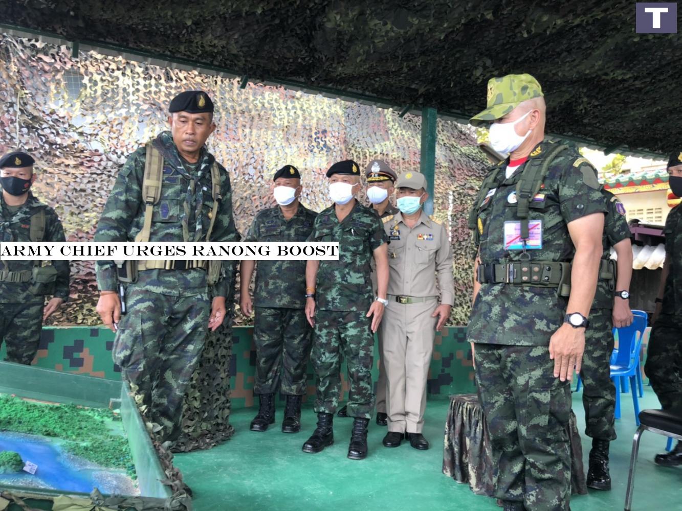 THE LOWDOWN: Army commander Gen Narongphan Jitkaewtae (right) is briefed on security issues during his tour of Ranong which borders Myanmar on Saturday. Army chief urges Ranong boost
