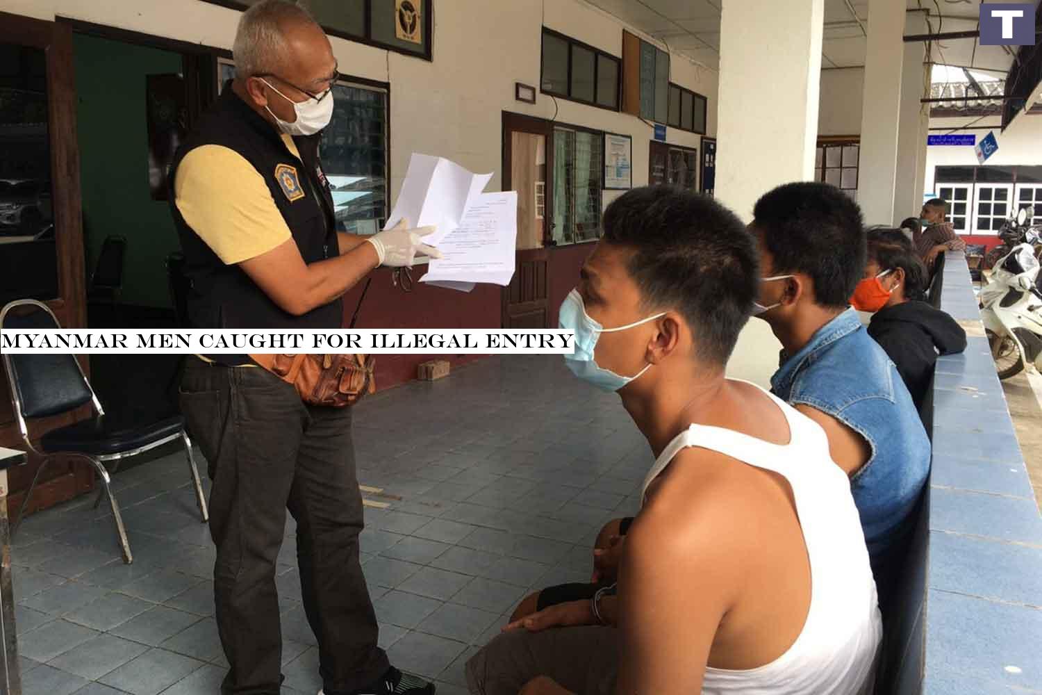 The two arrested Myanmar men, seated, at Sangkhlaburi police station in Kanchanaburi after being caught illegaly crossing the border into Thailand on Monday. (Photo: Piyarat Chongcharoen) Myanmar men caught for illegal entry